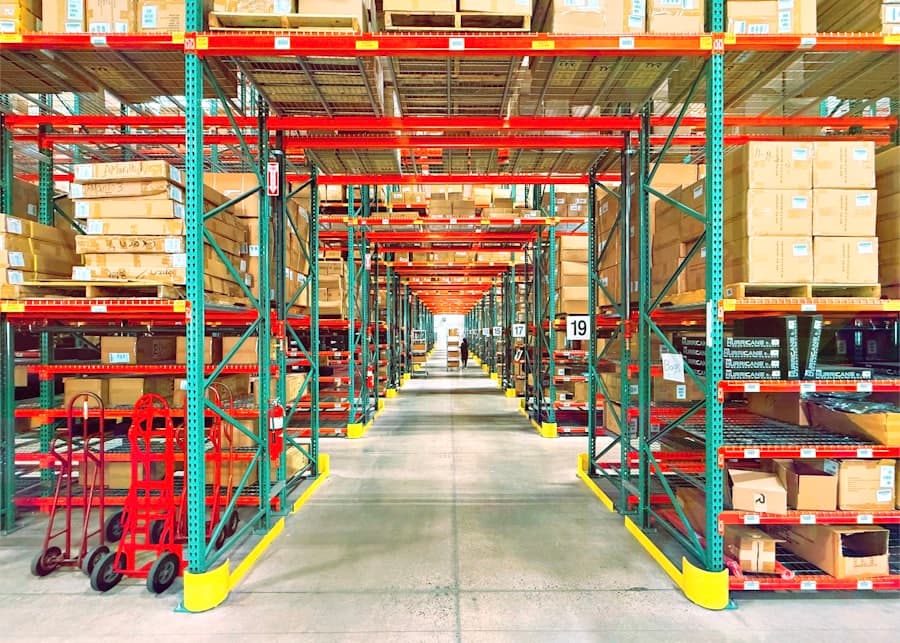 Warehouse aisle lined with racking and palletised boxes